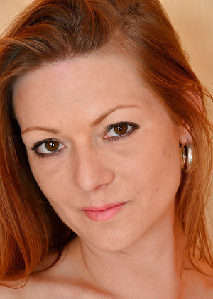 18 year old girl Katie Lewis stands naked after undressing in her bedroom